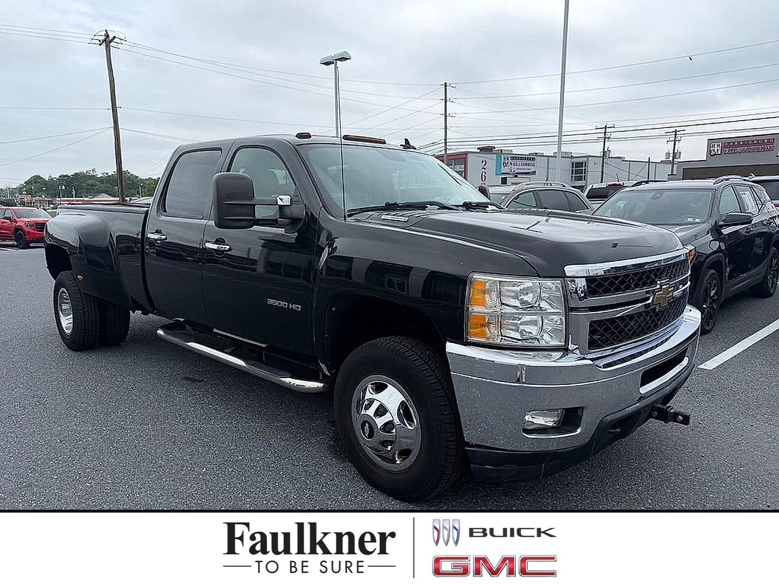 2011 Chevrolet Silverado 3500 HD DRW LTZ in Black — front three-quarter view