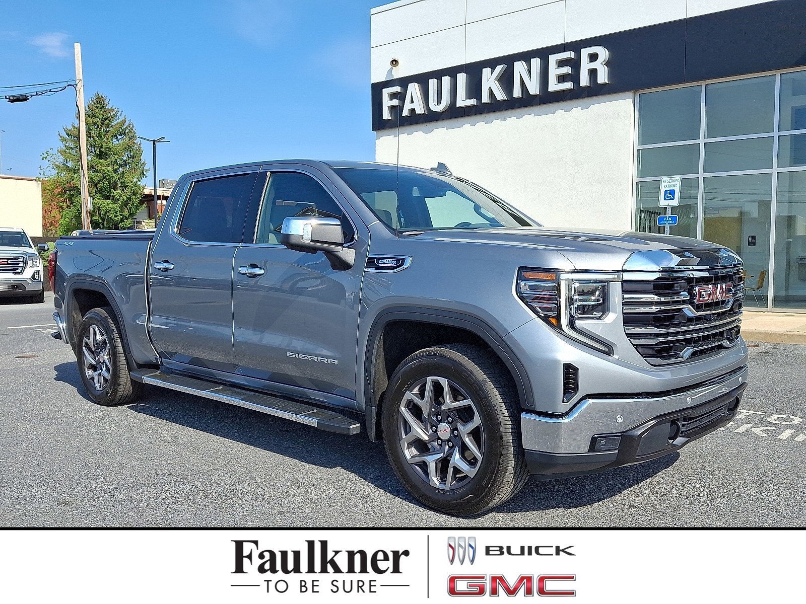 2024 GMC Sierra 1500 SLT in Sterling Metallic — front three-quarter view