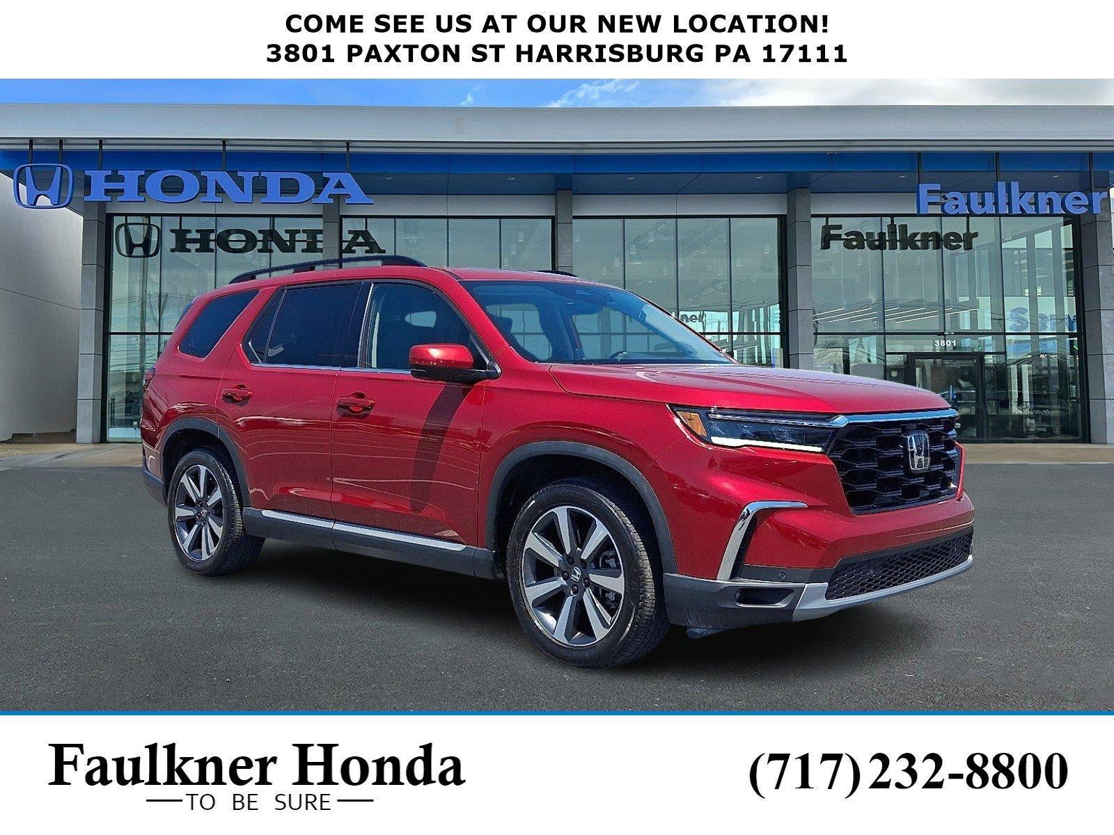 2025 Honda Pilot Touring AWD in Radiant Red Metallic II — front three-quarter view