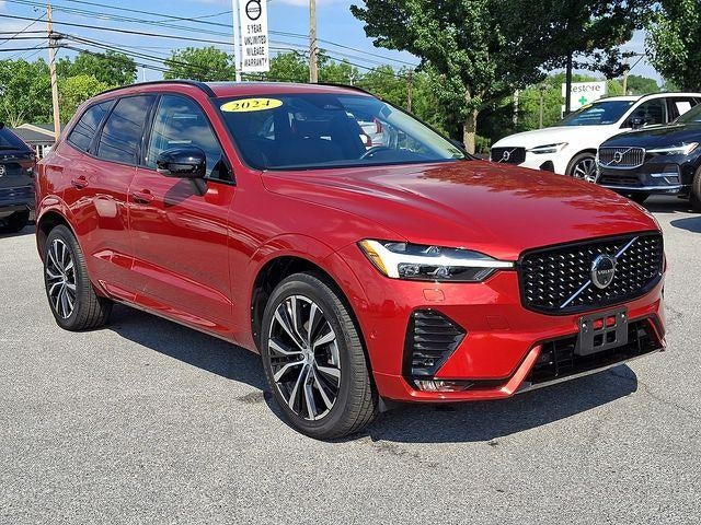 2024 Volvo XC60 B5 AWD Plus Dark Theme in Fusion Red Metallic — front three-quarter view