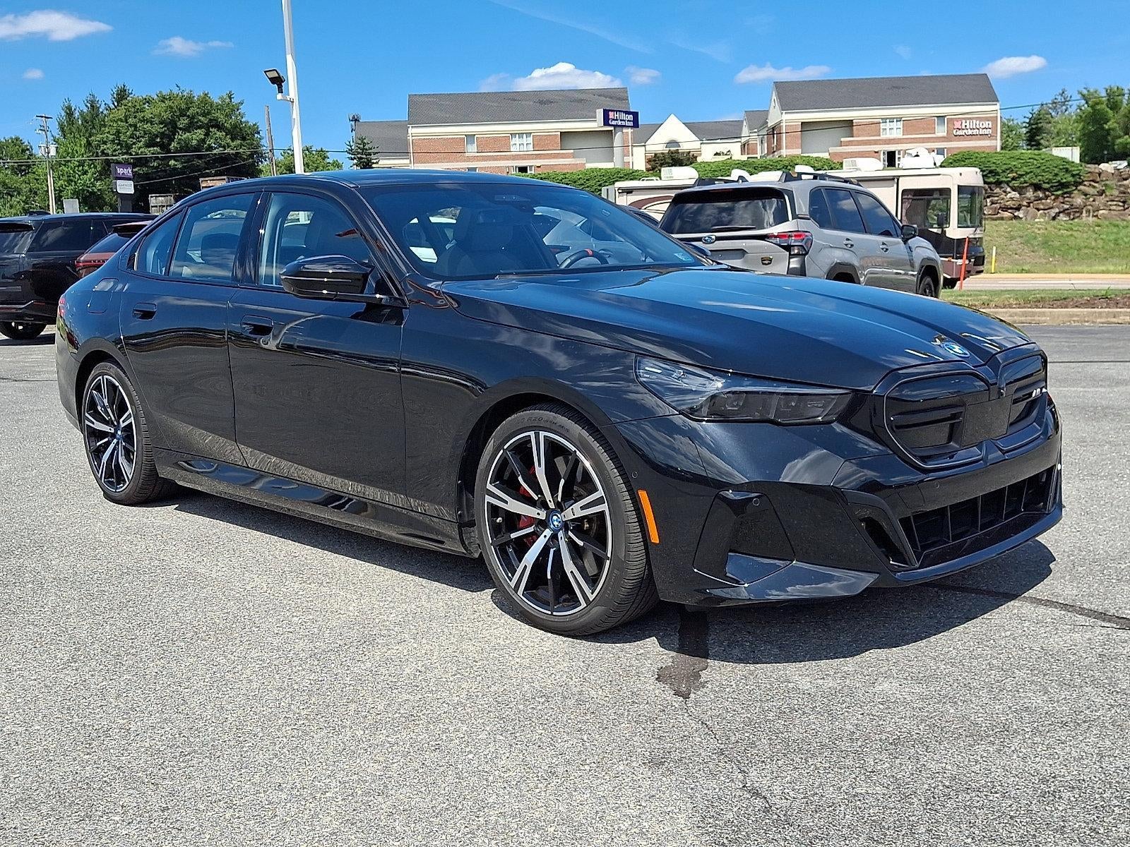 2024 BMW i5 M60 Sedan in Black Sapphire Metallic — front three-quarter view