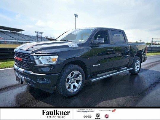 2023 RAM 1500 Big Horn 4x4 Crew Cab 5'7" Box in Diamond Black Crystal Pearlcoat — front three-quarter view