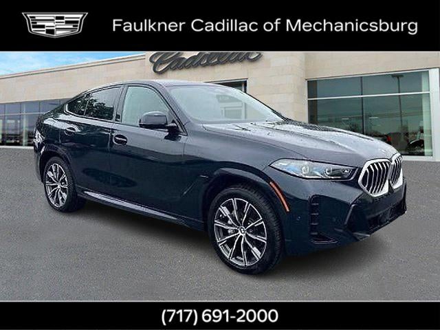 2024 BMW X6 xDrive40i in Black — front three-quarter view