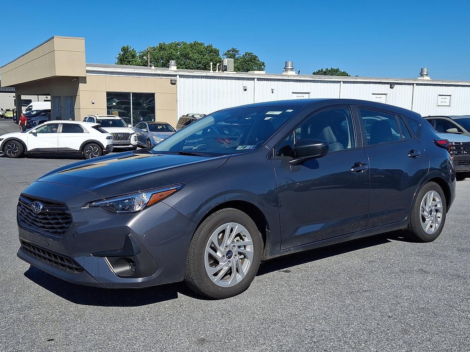 2024 Subaru Impreza AWD in Magnetite Gray Metallic — front three-quarter view